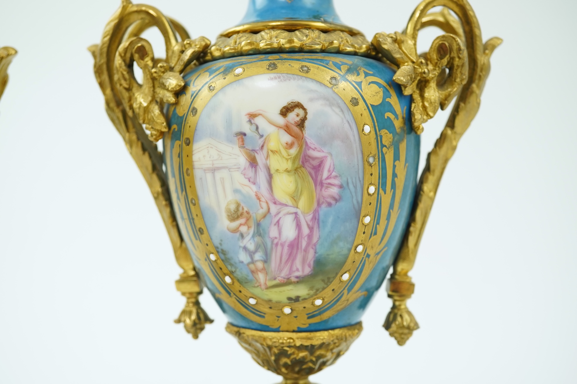 A pair of late 19th century ormolu mounted Sevres style porcelain cassolettes